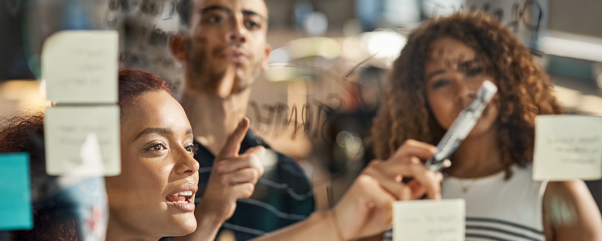 People looking at sticky notes