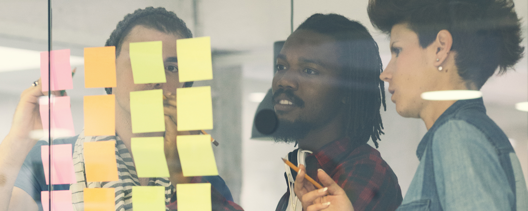 People looking at sticky notes