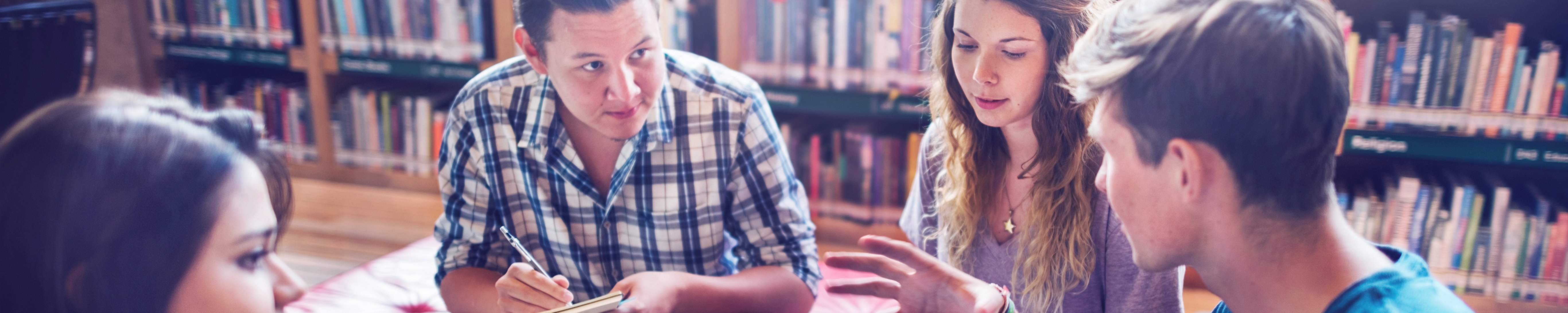 Group of people discussing at library